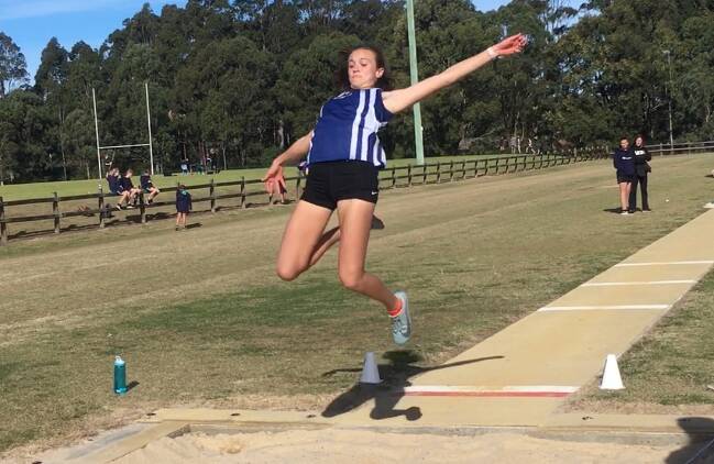 HANG TIME: Nowra High School's Lara Check flies high during the under 16 girls long jump at the recent Shoalhaven Zone Athletics Carnival. Photo: JANIE HAMILTON