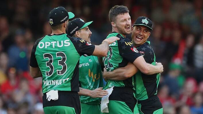 Nic Maddinson (second from left) celebrates a wicket with his Melbourne Stars team mates on Saturday night. Photo: STARS MEDIA