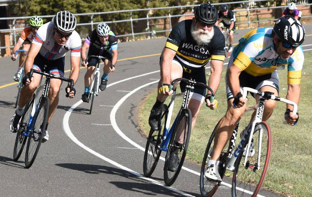 Multi-talented: Nowra Velo Club's Richard Vitiello (right) heading for a win on the Goulburn Velodrome.