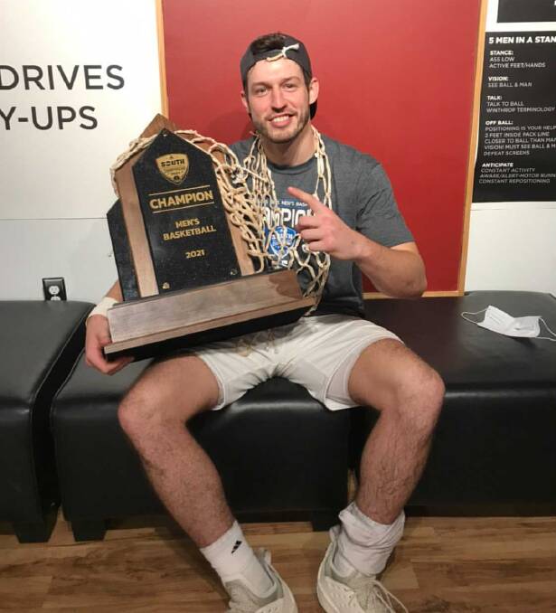 Kyle Zunic with the Big South Conference trophy. Photo: Supplied