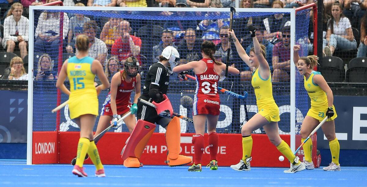 Kalindi Commerford (right) and her Hockeyroos team mates celebrate a goal against Great Britain. Photo: GB HOCKEY