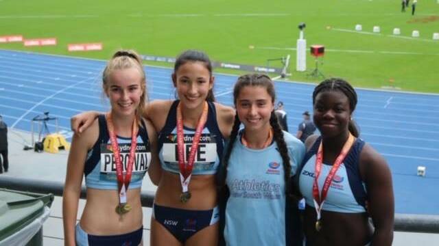 Lauren Percival with her under 16s relay team after winning 2019 Australian title. Photo: Supplied