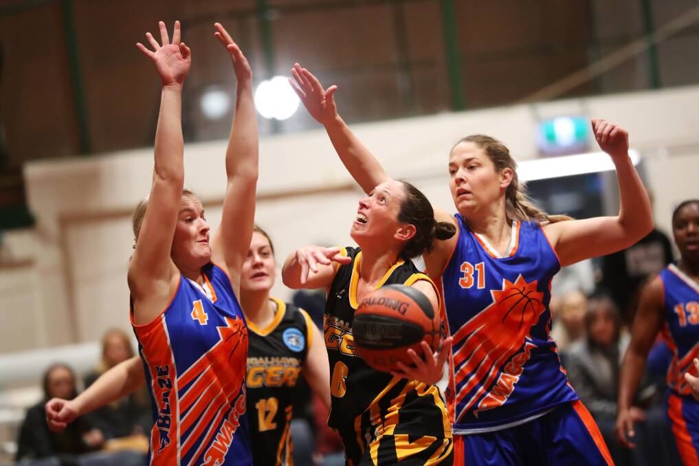 Shoalhaven Tigers' Mary Jane Toole goes for a lay-up against Wagga Wagga last season. Photo: EMMA HIDLER