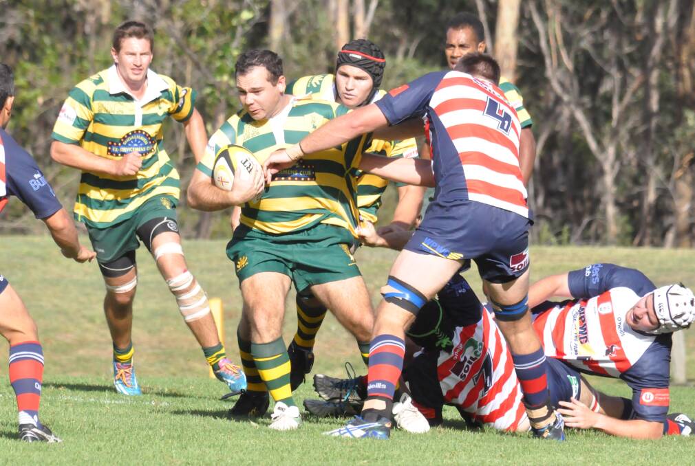 Shoals skipper Steven Brandon tries to break a tackle during the 2019 Illawarra Rugby season. Photo: Damian McGill