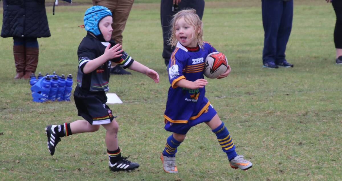 good effort: Mud and rain were no problem for U6 player Cooper Crane, who scored two tries.