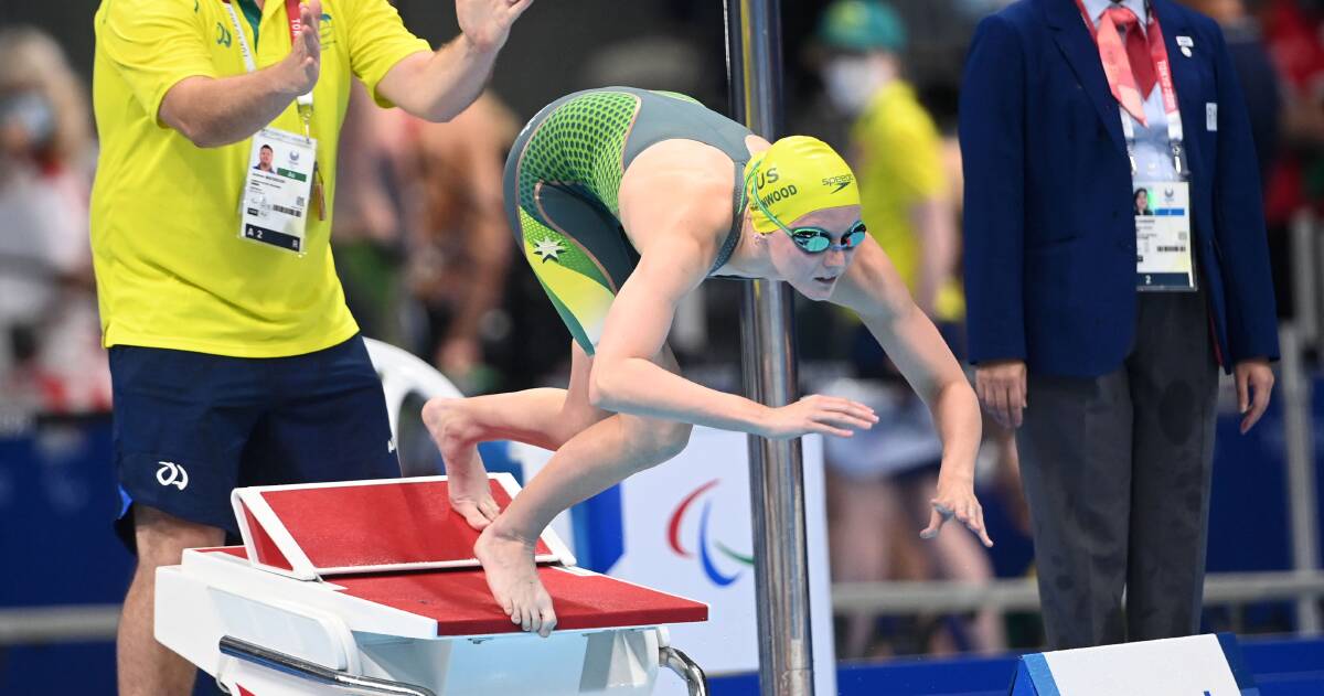 Jasmine Greenwood dives into the pool during her S10 women's 100-metre freestyle final on Saturday. Photo: Delly Carr