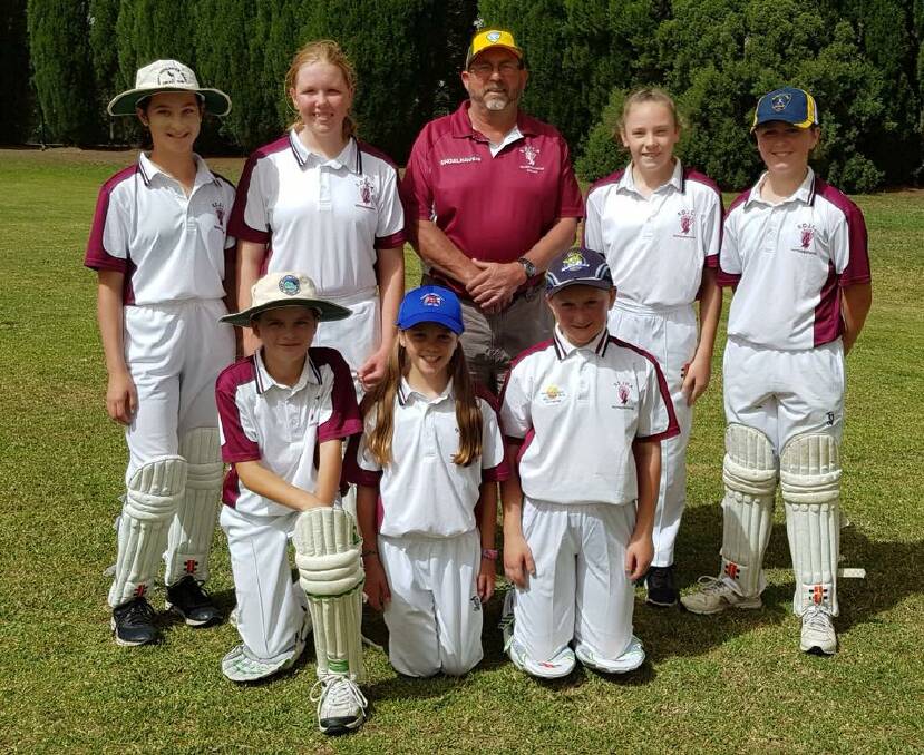 Coach Brett Mark and his under 14s Shoalhaven girls cricket team.
