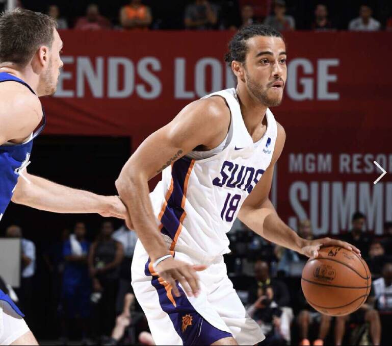 Xavier Cooks dribbles the ball while playing for the Phoenix Suns. Photo: SUPPLIED