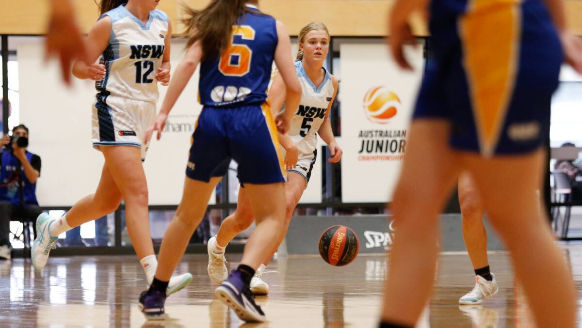 Asha Phillips tries to find a hole in ACT's defence at the national titles. Photo: Jaylee Ismay/Basketball NSW
