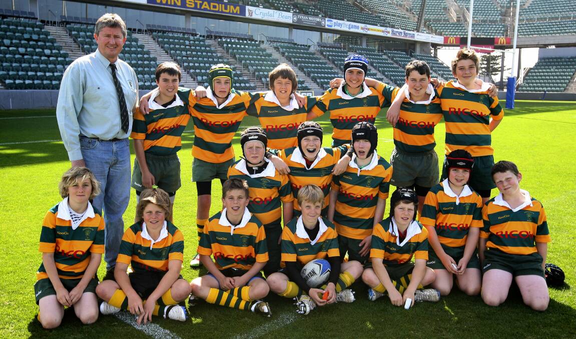 George Miller (front row, fourth from left) and his Shoalhaven under 12s rugby union side at WIN Stadium. Photo: SYLVIA LIBER