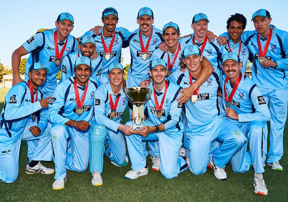 Matthew Gilkes (front row, third from left) and his Blues side after their win. Photo: Cricket NSW
