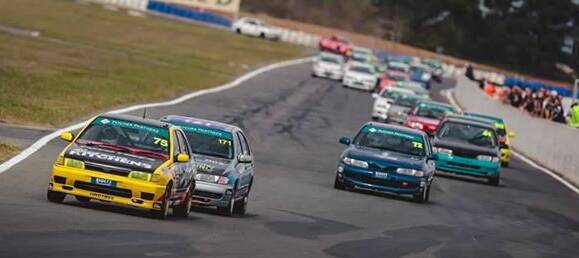 Daniel Smith (yellow car) races in his Pulsar. Photo: Dave Oliver, DO-photo