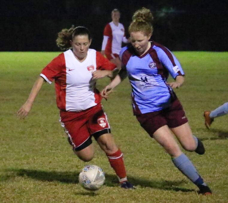 St Georges Basin's Jess Brandon and Shoalhaven Heads-Berry Maroon's Tara Culey contest the ball on Tuesday. Photo: Tamara Lee
