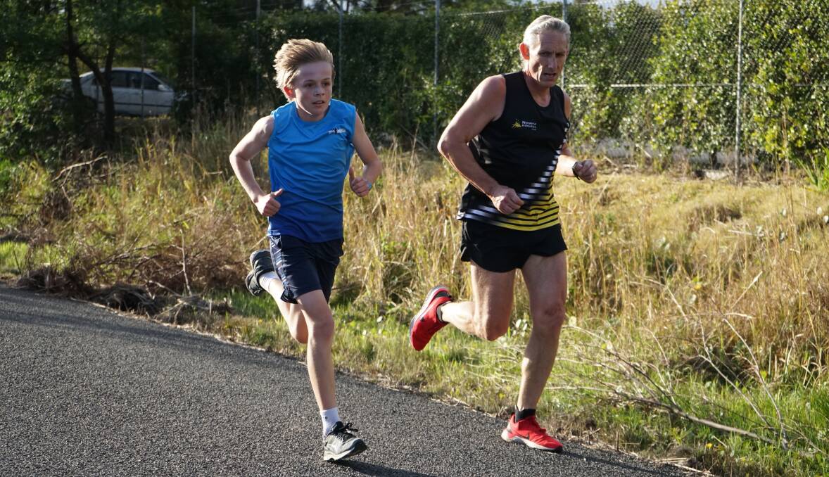 SPEED: Nowra Athletics Club's Harrison Baxter overtakes Scott Johnson at the Vincentia course on Saturday.