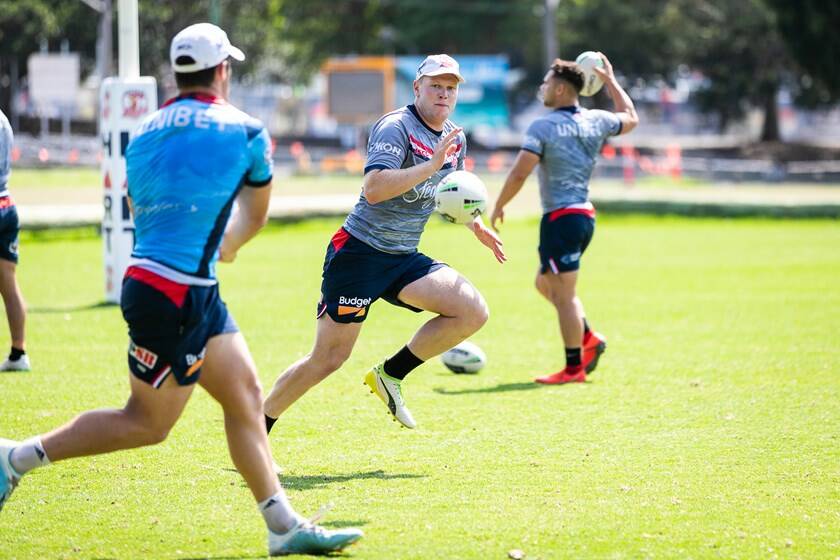 Drew Hutchison sets himself to receive a pass during a Roosters pre-season training session. Photo: ROOSTERS MEDIA
