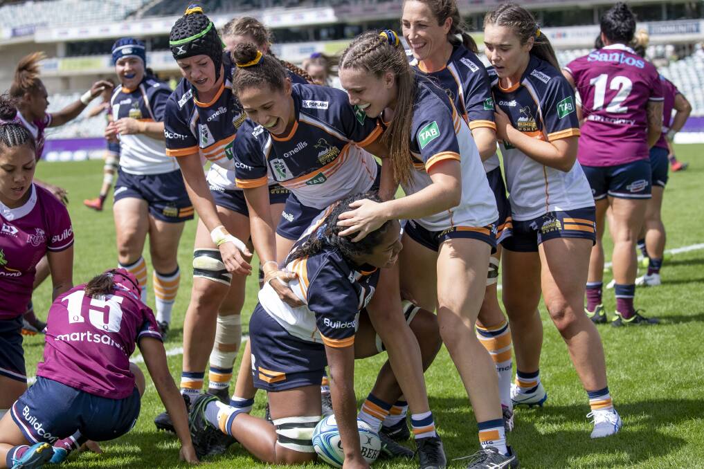 The ACT Brumbies celebrate the try of Emma Masi on Sunday. Photo: Sitthixay Ditthavong