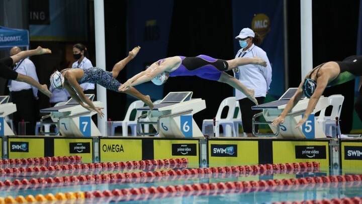 Talika Irvine (purple swimsuit) dives into the pool during the 2020-21 season. Photo: Supplied