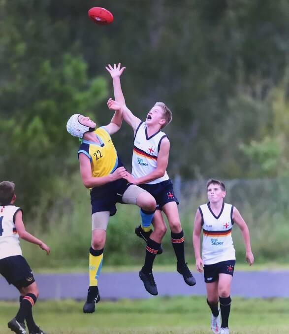 South Coast's CJ Malmborg goes up for a ruck contest against CIS. Photo: Supplied