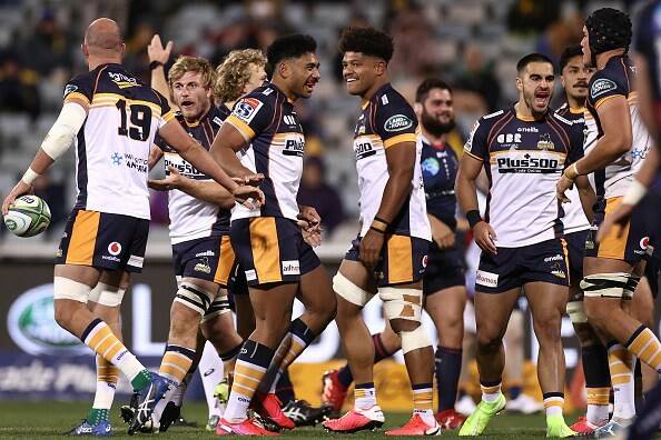 Will Miller (second from left) and his ACT side celebrate a try on Saturday night against the Rebels. Photo: Brumbies Rugby