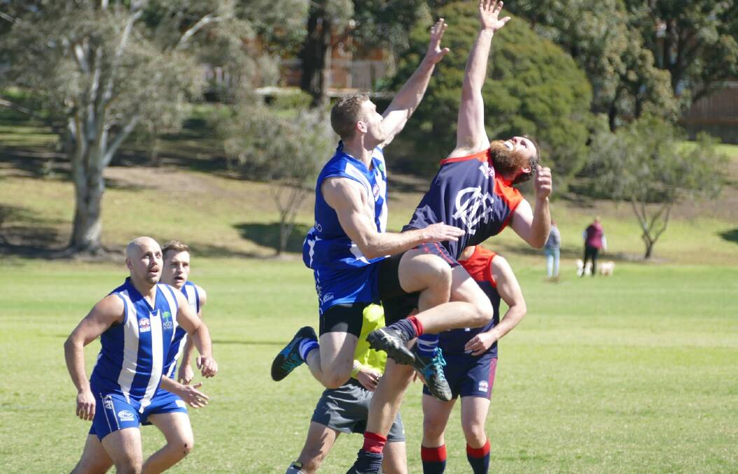 BIG DANCE: Nowra-Albatross' Marco Basaglia goes up for a ruck contest against Figtree on Saturday at Hollymount Park. Photo: AFLSC