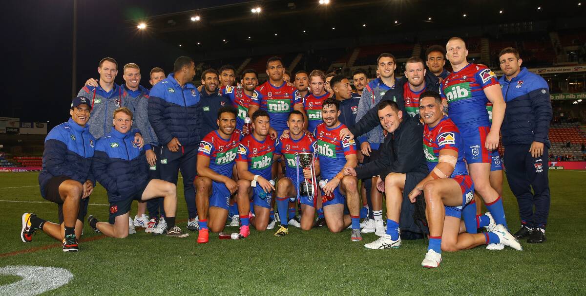 The Newcastle Knights with the Alex McKinnon Cup. Photo: Paul Barkley/NRL Imagery