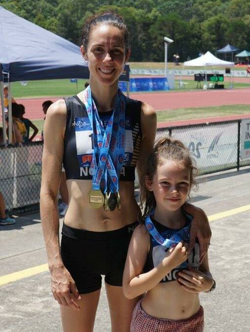 All in the family: Erin Smart won three gold medals in the 30-39 years age group while little Evie won a bronze medal.