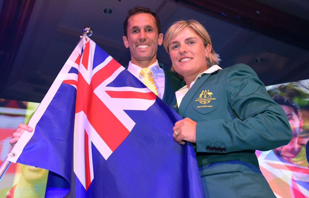 NATIONAL PRIDE: Former Shaolhaven Heads lawn bowler Karen Murphy with Australian flag bearer of the 2018 Commonwealth Games team Mark Knowles - who plays for the Kookaburras. Photo: Tracey Nearmy