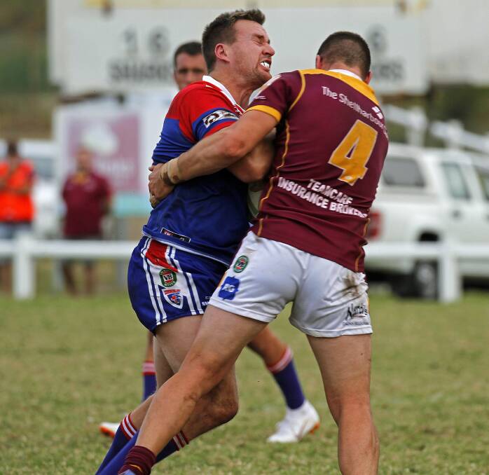 Gerringong's Joel Roberts is tackled by Shellharbour's Wayde Aitken. Photo: GAME FACE PHOTOGRAPHY