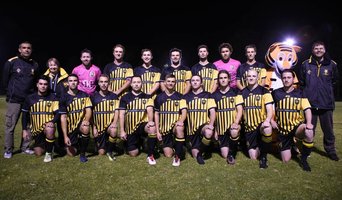 BLACK AND GOLD PRIDE: Nathan Aldridge (back left) and his Bomaderry FC side prior to Wednesday's match. Photo: COURTNEY WARD