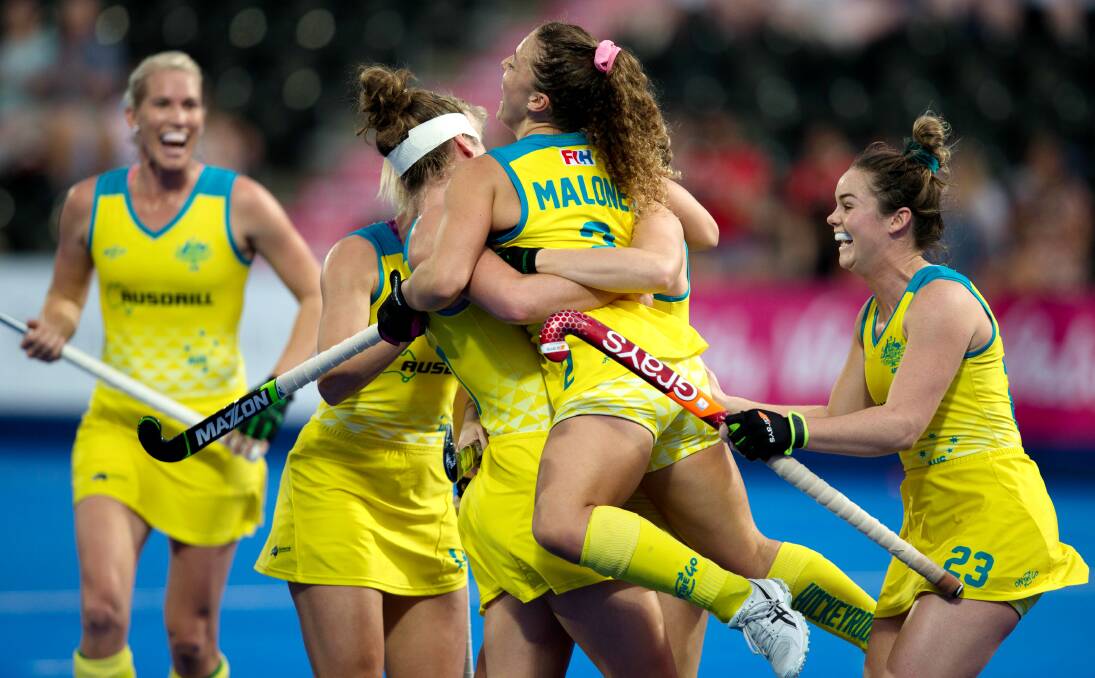 Kalindi Commerford (right) celebrates a goal with her Hockeyroos team mates. Photo: WORLD SPORTS PICS