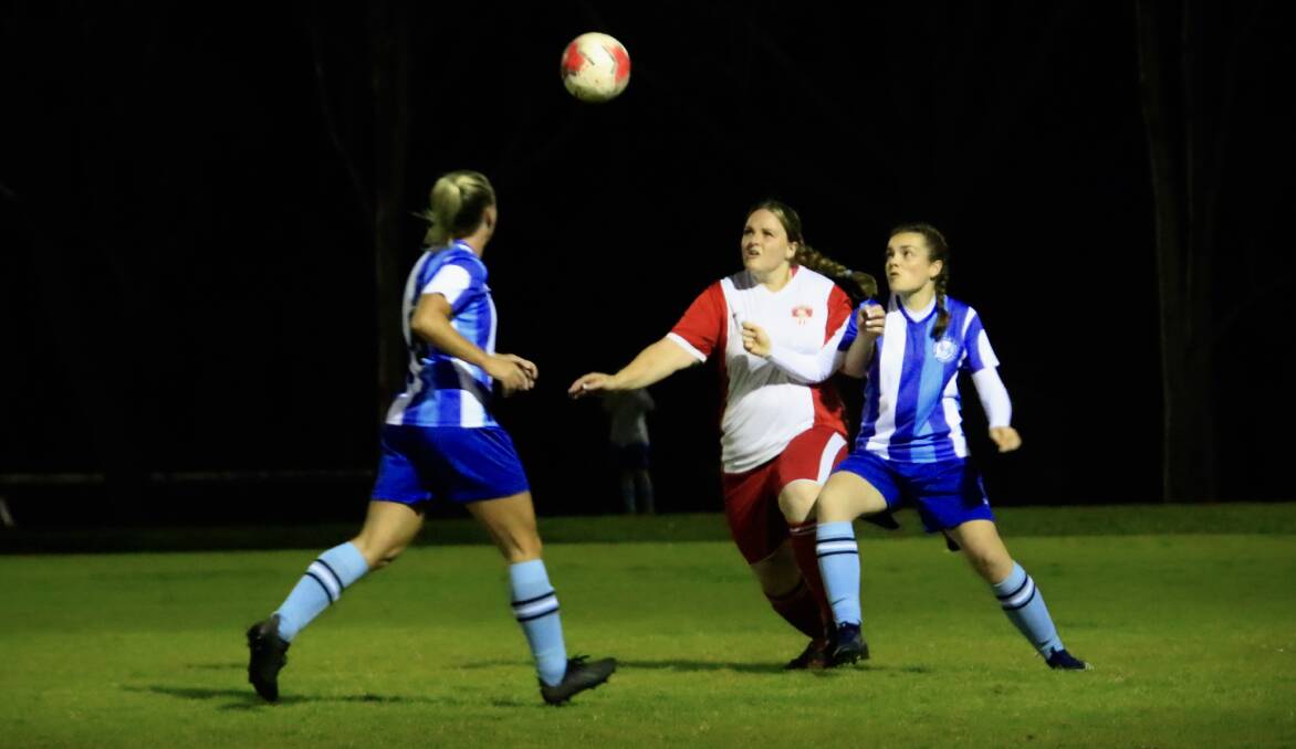 St Georges Basin's Crystal Foster takes on two Sussex Inlet defenders on Tuesday. Photo: Tamara Lee