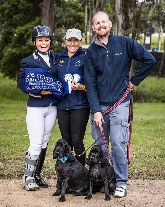 Victoria Davies with close friend/equine groom Shae Herwig, husband Michael Koch and their cocker spaniels Benji and Whitney. Photo: Stephen Mowbray