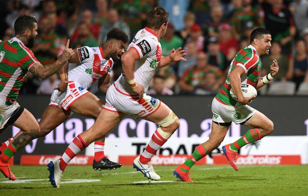 Souths' Cody Walker makes a break against the Dragons. Photo: AAP