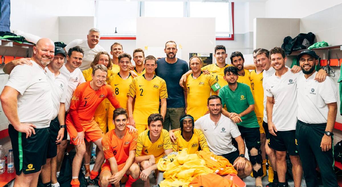Ben Atkins (standing up, ninth from left) and his Pararoos in Spain. Photo: Kenny Bower.