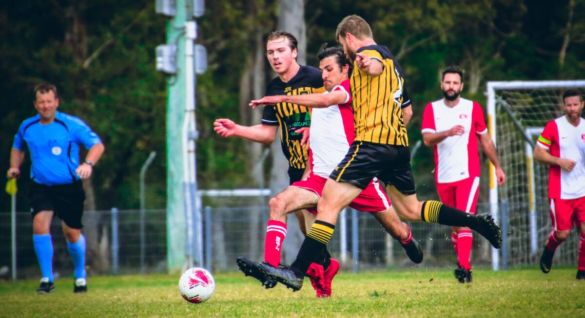 St Georges Basin's Beau Locke-Williams attacks the ball during the reserve grade fixture against Bomaderry. Photo: Tamara Lee