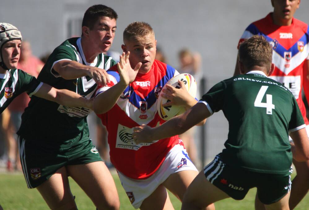 Jonah Longbottom takes a hit-up for his Illawarra South Coast Dragons side during this year's CRL Country Championships. Photo: SAM PASFIELD
