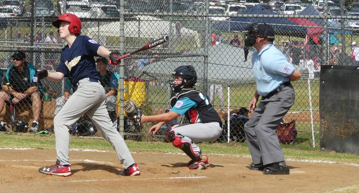 BIG SHOT: Stephen Pearson, playing for the Illawarra little league majors baseball team, hits a double with a run batted in against Central Coast on Thursday.