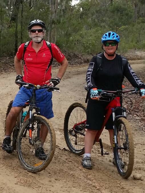 GET PHYSICAL: Menno Van Doorn and Sharyn McCullagh take a break during a recent BUG off road ride.