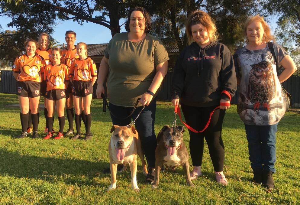 Group Seven referees Paul Lees, Balunn Simon, Sophie Hartley, Jayla Commins and Jorja Wettengel with Best Friends For Ever Rescue's Katie McCarroll, Tay Ljilak and Jennine Wallace - who hold dogs King and Queen. Photo: Courtney Ward
