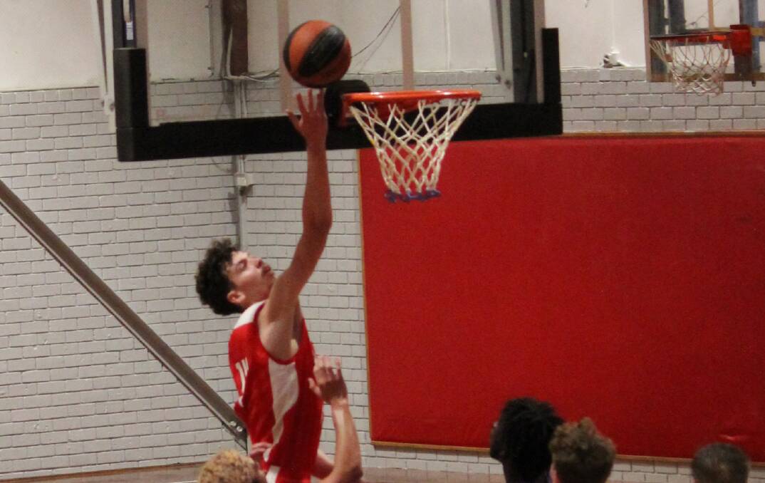 Illawarra Hawks' Philip Dopud goes up for a lay-up against the Hornsby Ku Ring Gai Spiders. Photo: Fiona Costain