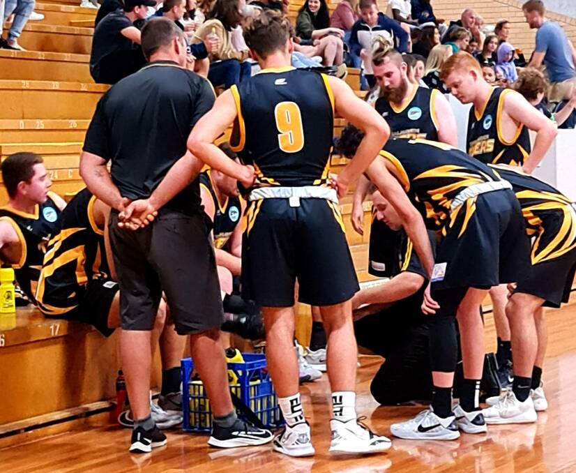 Ben Bagoly chats to his Shoalhaven Tigers men's side during their win against Central Coast. Photo: Supplied