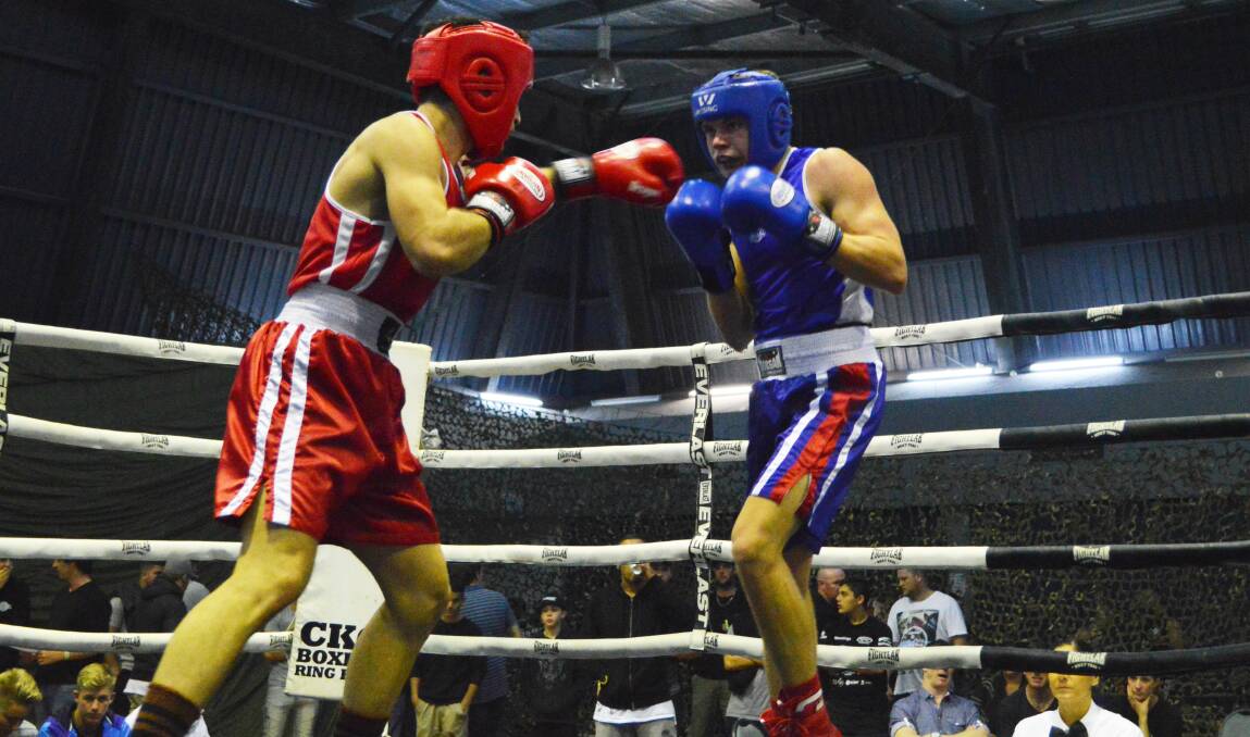 CHASING HIS DREAMS: North Nowra's Brock Harris (blue) has big plans for what he can achieve in the boxing ring.