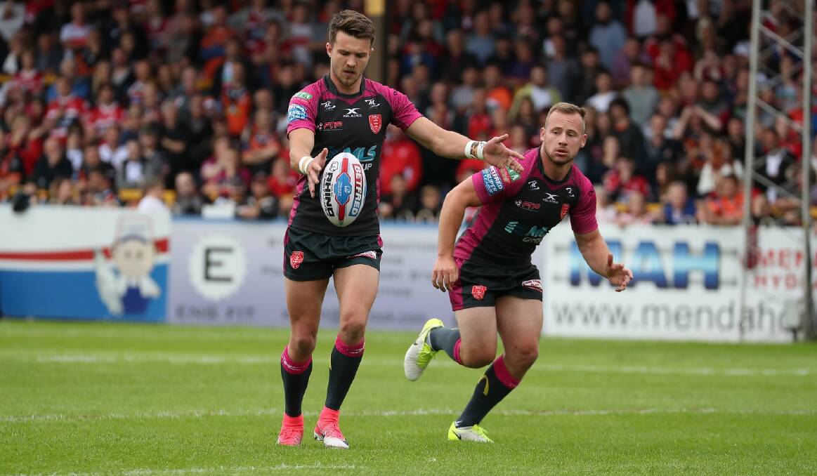 Hull KR's Adam Quinlan (right) prepares to chase a Matty Marsh kick against Castleford. Photo: ROVERS MEDIA