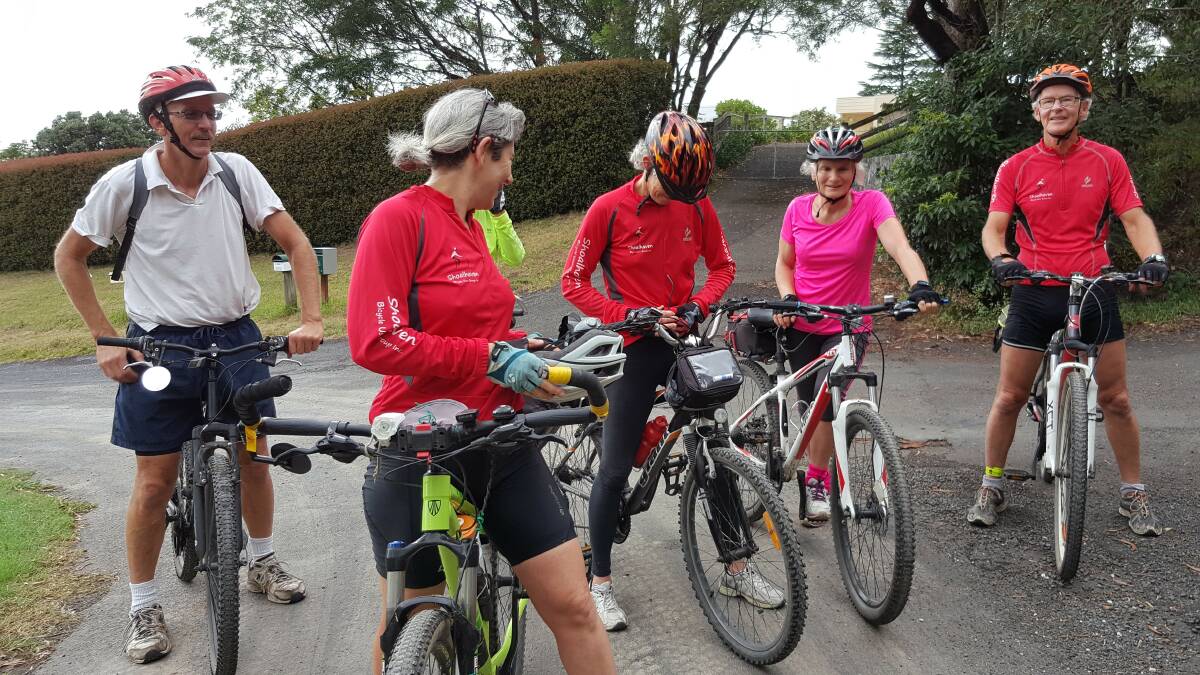 SPIN CYCLE: Rob Cleary, Rod Pierce, Lani Imhoff, Karen Davis, Leslie Ann Redacliffe and Ray Martin on Graham Smith's famous IGA ride through Bomaderry.