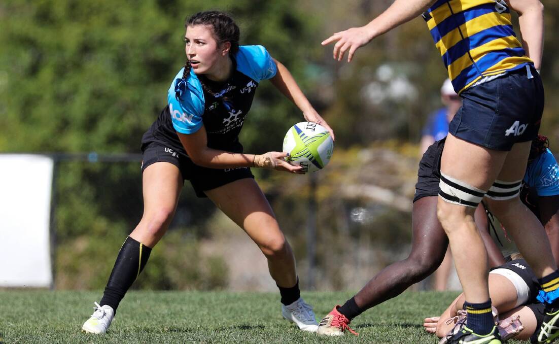 Lily Murdoch in action for her University of Canberra side during the Aon Sevens Series. Photo: KAZ WATSON