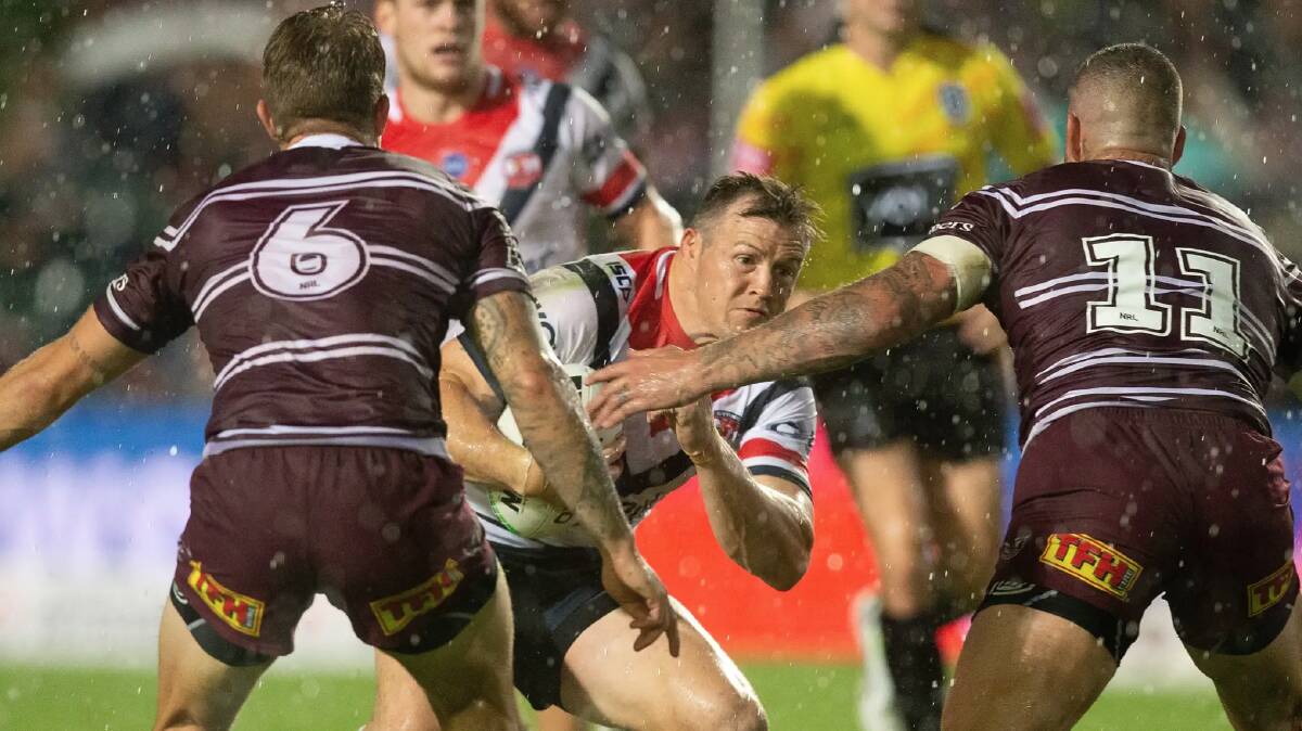 Brett Morris takes a hit-up for the Roosters against the Sea Eagles. Photo: AAP