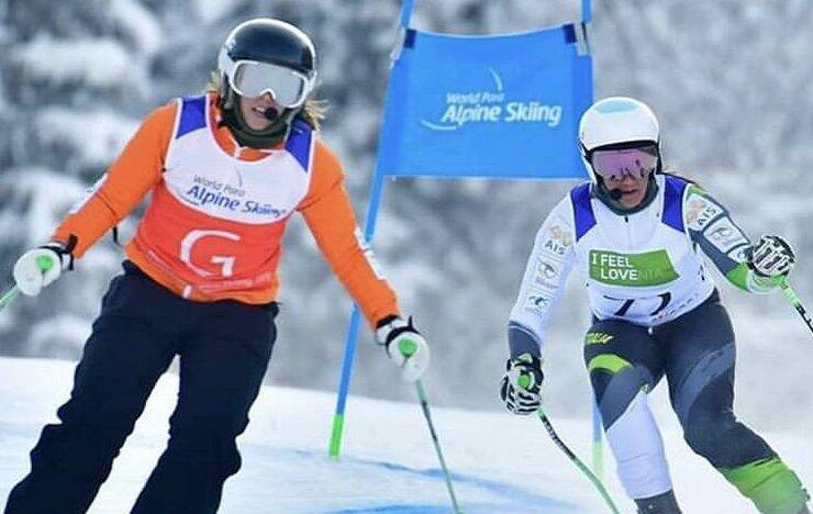 Meliisa Perrine (right) and her sighted guide Bobbi Kelly compete during the World Para Alpine Skiing Championships in Slovenia. Photo: Australian Paralympic Committee