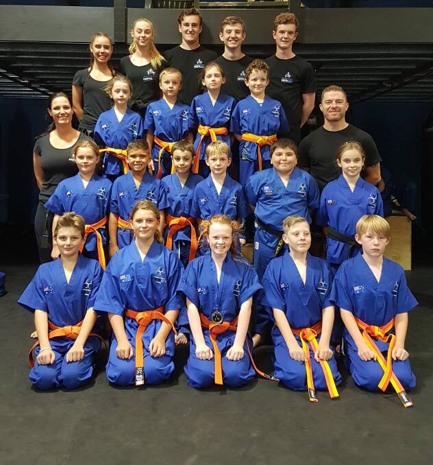 TOUGH CUSTOMERS: Southern Fitness and Martial Arts Centre Bomaderry's intermediate junior kick-defence and their instructors, following their recent term one gradings.