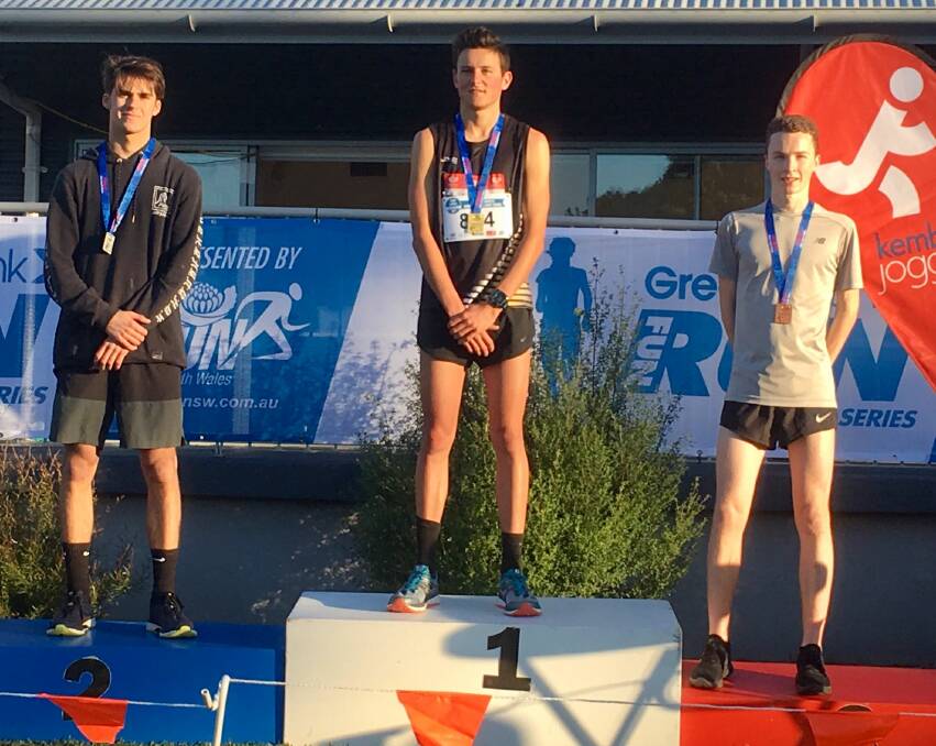 Top of the podium: Nowra Athletics' Troy Whittington (centre) claimed gold in the men’s U20 5000m.