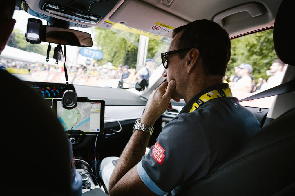 Kevin Poulton travels in a team car during the 2019 Tour de France. Photo: Kathrin Schafbauer 